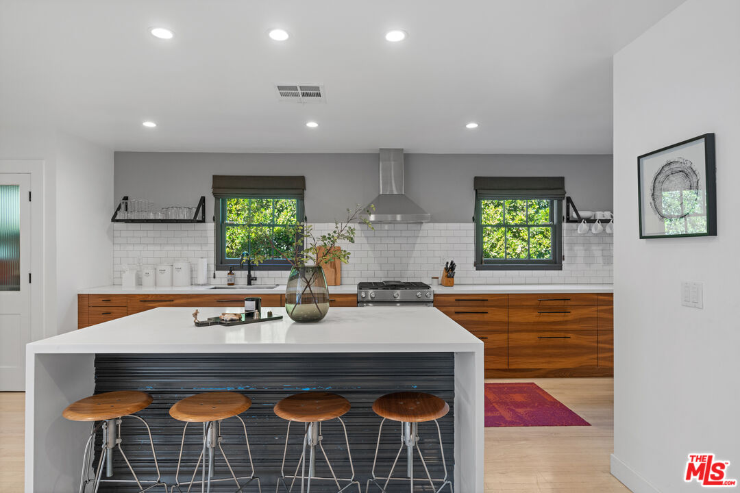 3301 McLaughlin Avenue Los Angeles, CA 90066 - Photo 15 of 46 a kitchen with a stove a sink and a refrigerator
