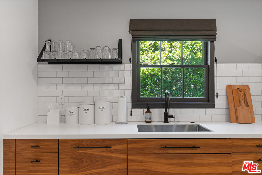 3301 McLaughlin Avenue Los Angeles, CA 90066 - Photo 16 of 46 a bathroom with a sink and a window