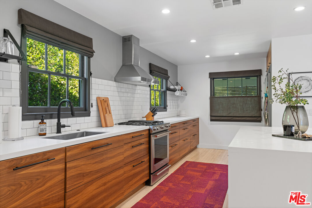 3301 McLaughlin Avenue Los Angeles, CA 90066 - Photo 18 of 46 a spacious bathroom with stainless steel appliances double vanity and a sink