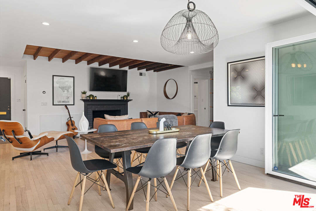 3301 McLaughlin Avenue Los Angeles, CA 90066 - Photo 3 of 46 a view of a dining room with furniture and wooden floor