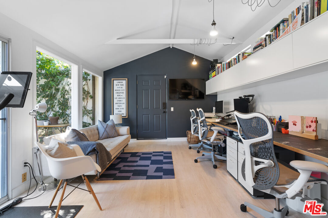 3301 McLaughlin Avenue Los Angeles, CA 90066 - Photo 25 of 46 a living room with furniture and a chandelier