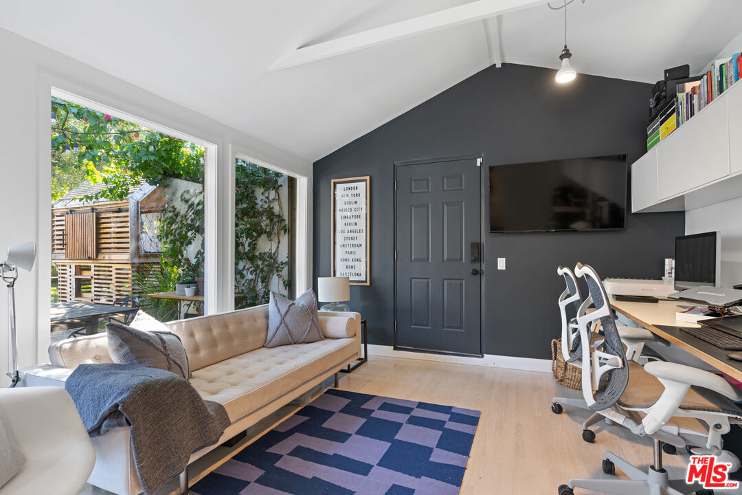 3301 McLaughlin Avenue Los Angeles, CA 90066 - Photo 27 of 46 a living room with furniture a flat screen tv and a large window
