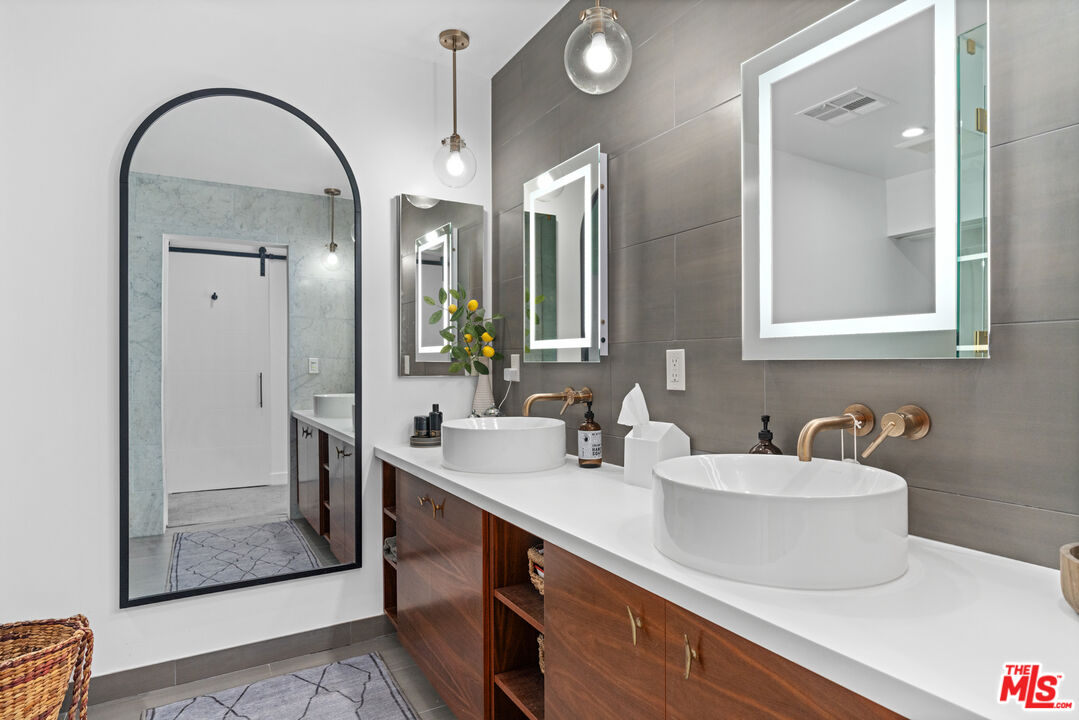 3301 McLaughlin Avenue Los Angeles, CA 90066 - Photo 32 of 46 a bathroom with a double vanity sink mirror and shower