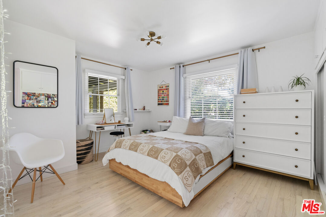 3301 McLaughlin Avenue Los Angeles, CA 90066 - Photo 35 of 46 a bedroom with a bed and a chair