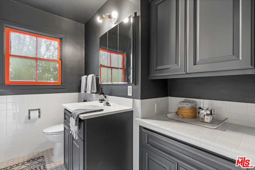 3301 McLaughlin Avenue Los Angeles, CA 90066 - Photo 37 of 46 a kitchen with a sink cabinets and a window