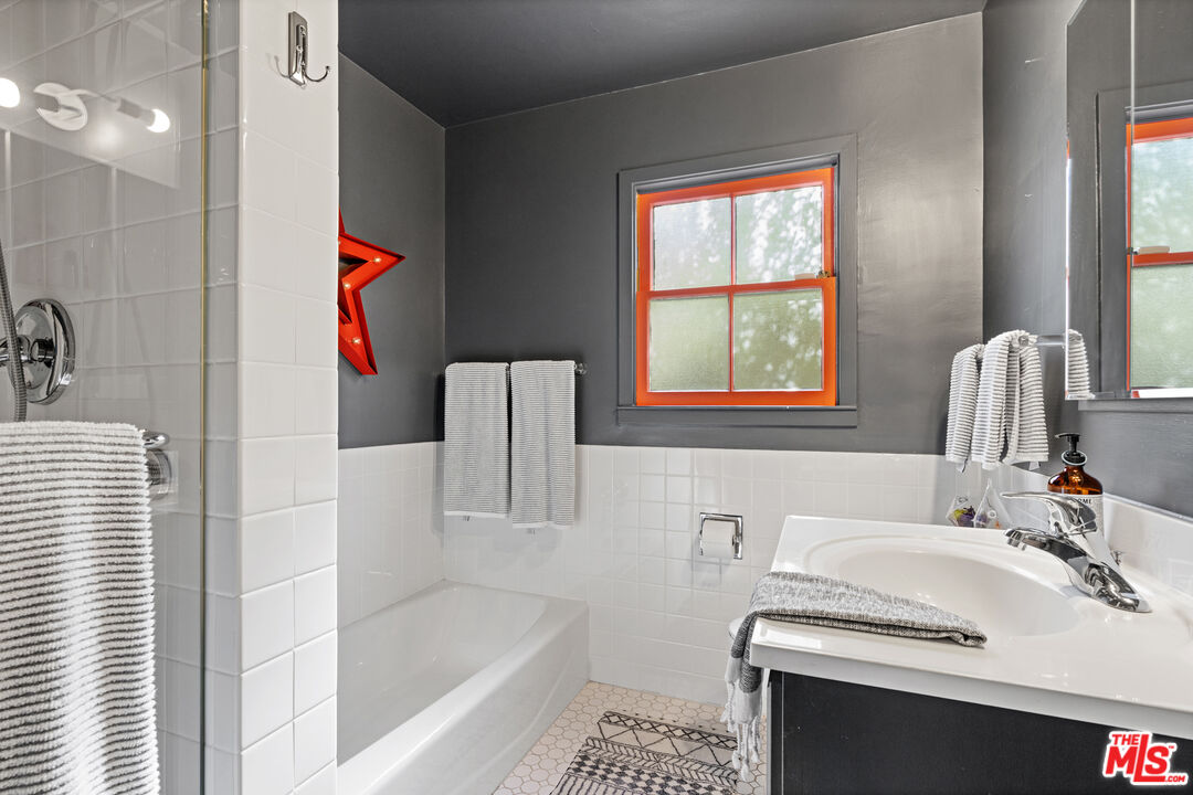 3301 McLaughlin Avenue Los Angeles, CA 90066 - Photo 38 of 46 a bathroom with a sink and a bathtub