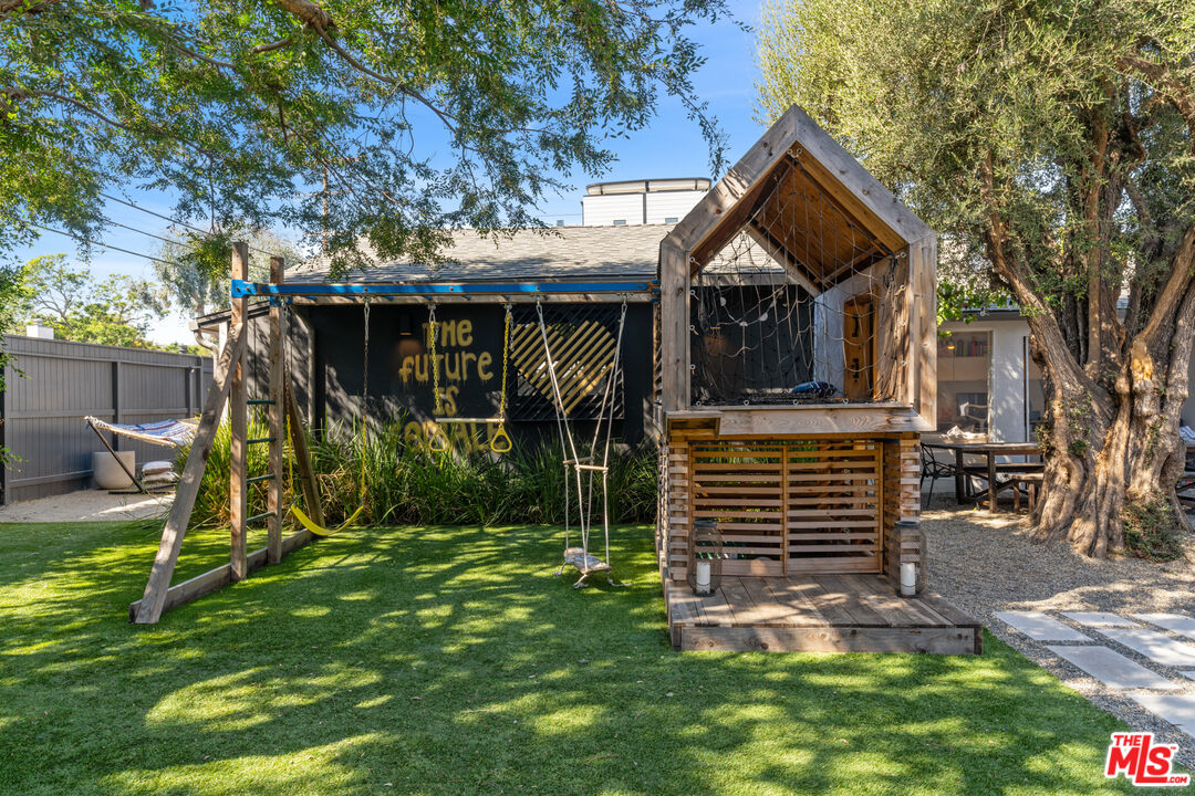 3301 McLaughlin Avenue Los Angeles, CA 90066 - Photo 40 of 46 a view of house with a yard and potted plants