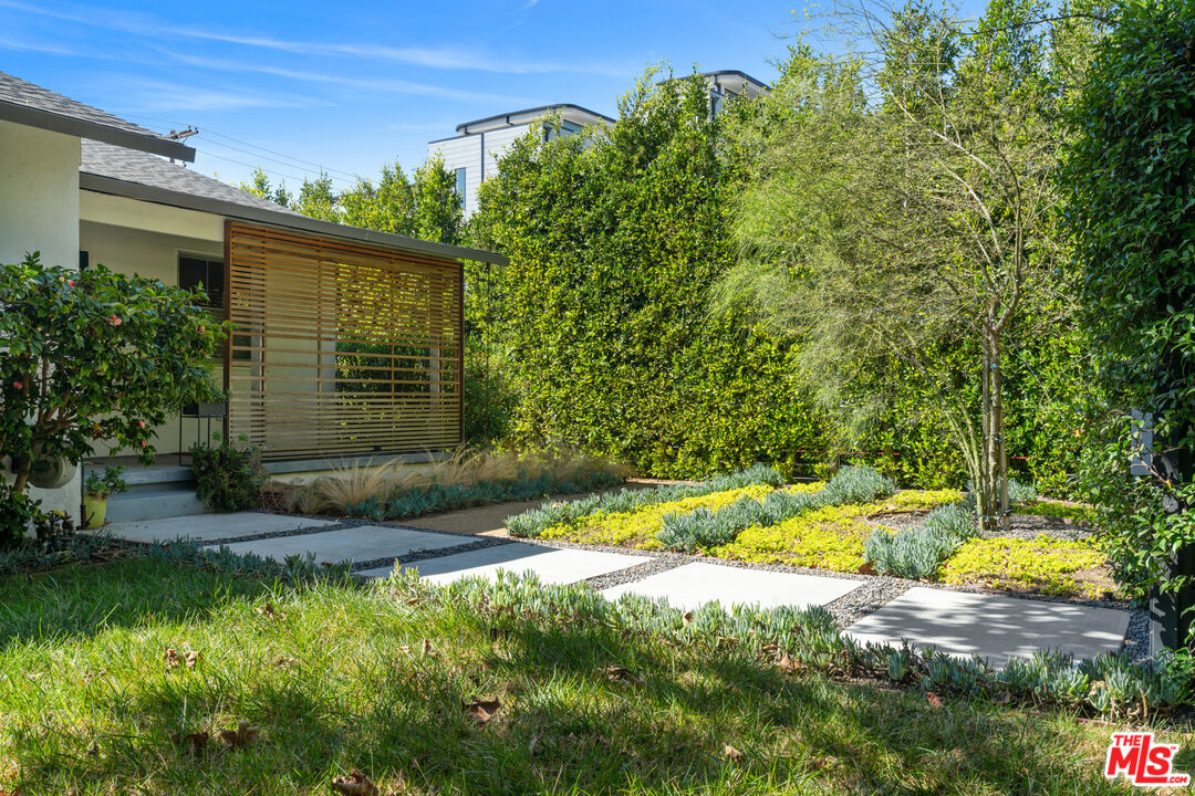 3301 McLaughlin Avenue Los Angeles, CA 90066 - Photo 42 of 46 a view of a backyard with plants and large trees