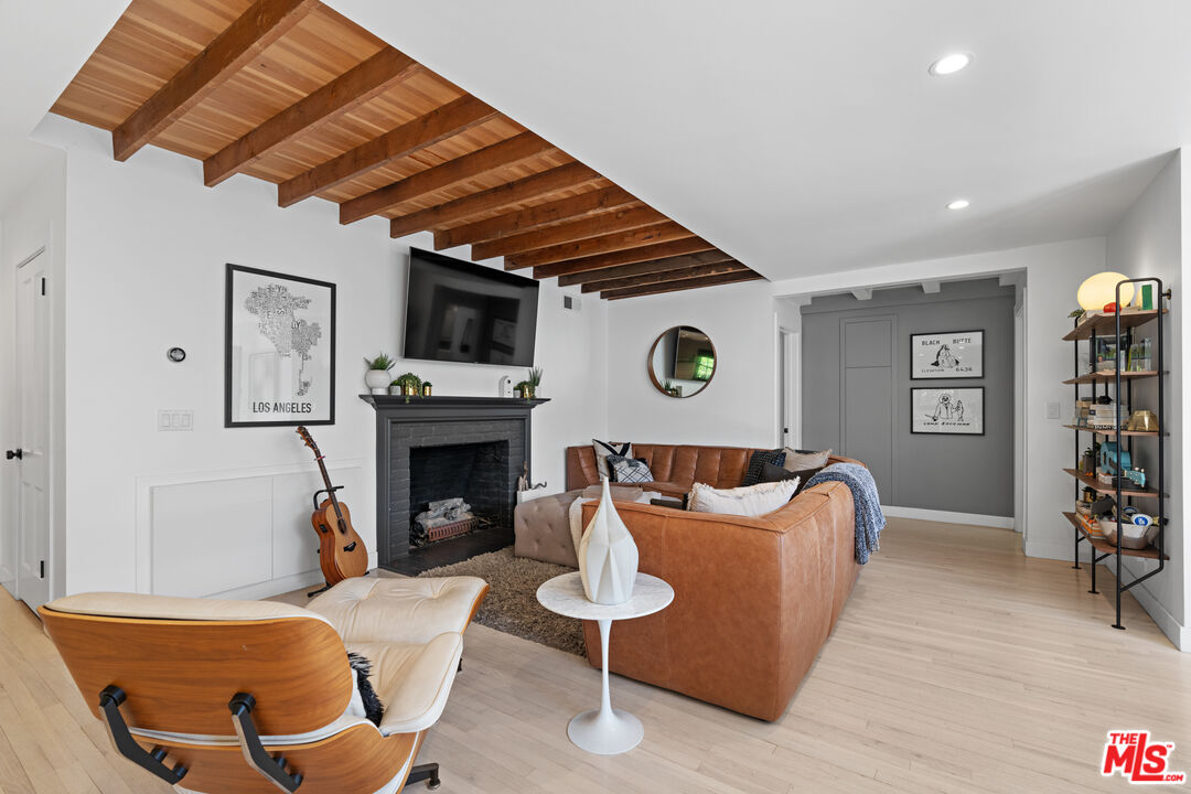 3301 McLaughlin Avenue Los Angeles, CA 90066 - Photo 7 of 46 a living room with furniture and a fireplace