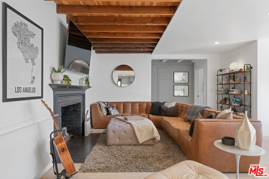 3301 McLaughlin Avenue Los Angeles, CA 90066 - Photo 8 of 46 a living room with furniture and a fireplace