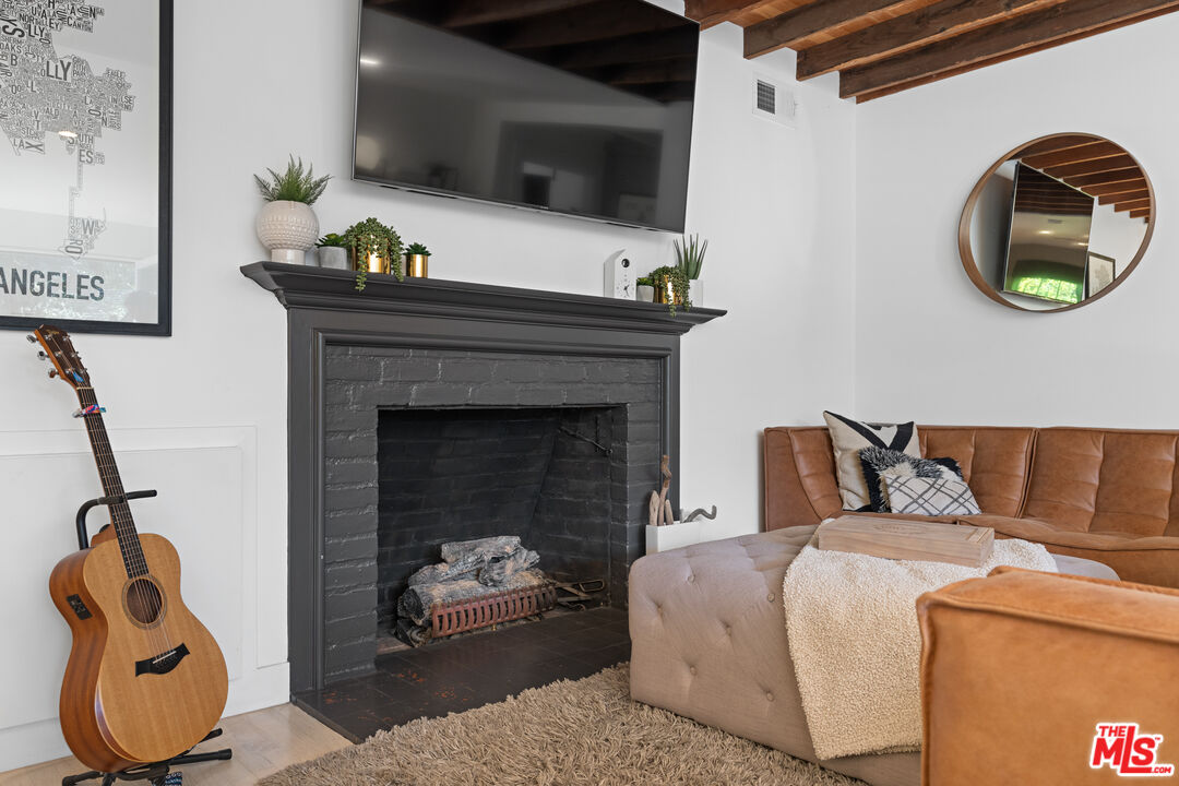 3301 McLaughlin Avenue Los Angeles, CA 90066 - Photo 9 of 46 a living room with a couch and a flat screen tv