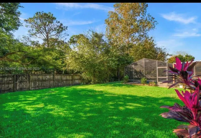 a backyard of a house with lots of green space