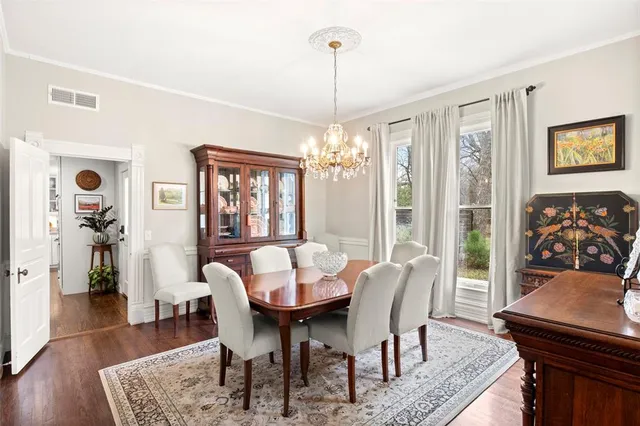 a large kitchen with a table and chairs