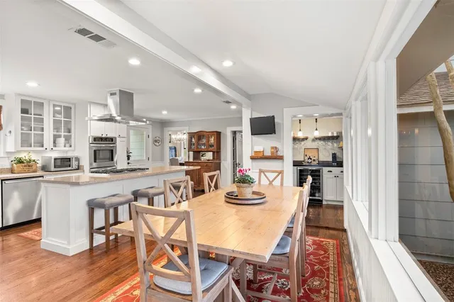 a kitchen with stainless steel appliances granite countertop a refrigerator and a stove