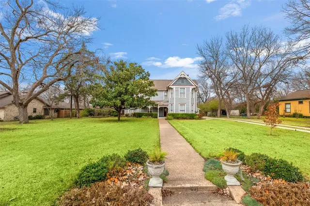 a front view of a house with garden