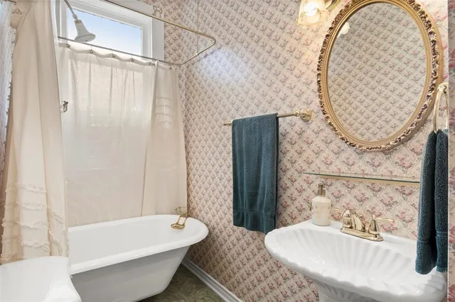 a bedroom with bed and window