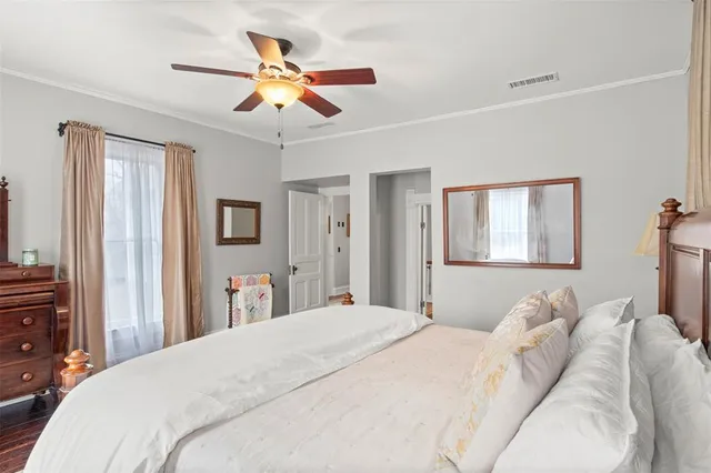 a spacious bathroom with a granite countertop sink a mirror and a shower