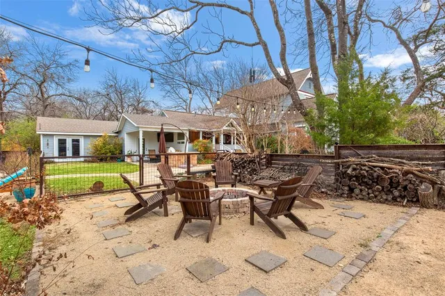 a view of a patio with table and chairs and potted plants