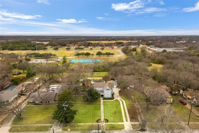 an aerial view of residential building with parking space