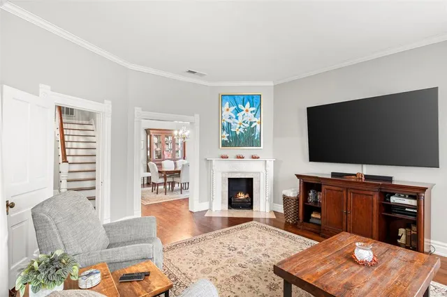 a living room with furniture fireplace and window