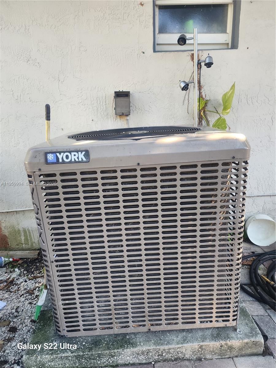 1747 Northwest 85th Street Miami, FL 33147 - Photo 5 of 12 a view of wooden door and a window