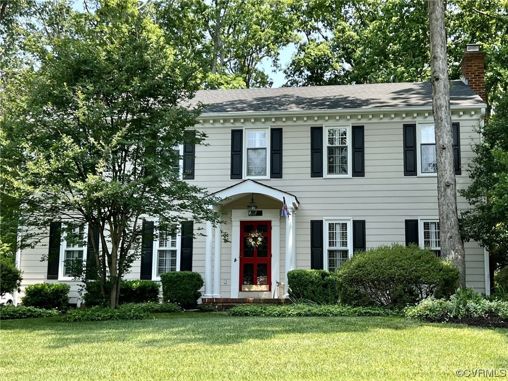 9408 Midvale Road Richmond, VA 23229 - Photo 1 of 24 a front view of a house with garden