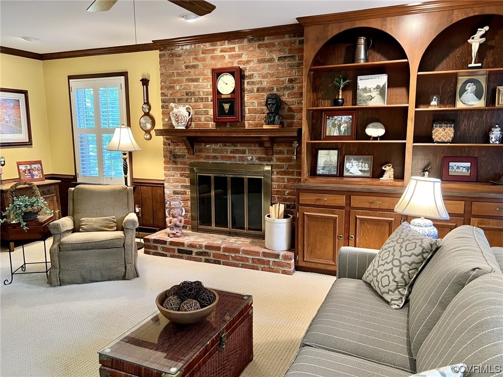 9408 Midvale Road Richmond, VA 23229 - Photo 13 of 24 a living room with furniture a rug and a fireplace