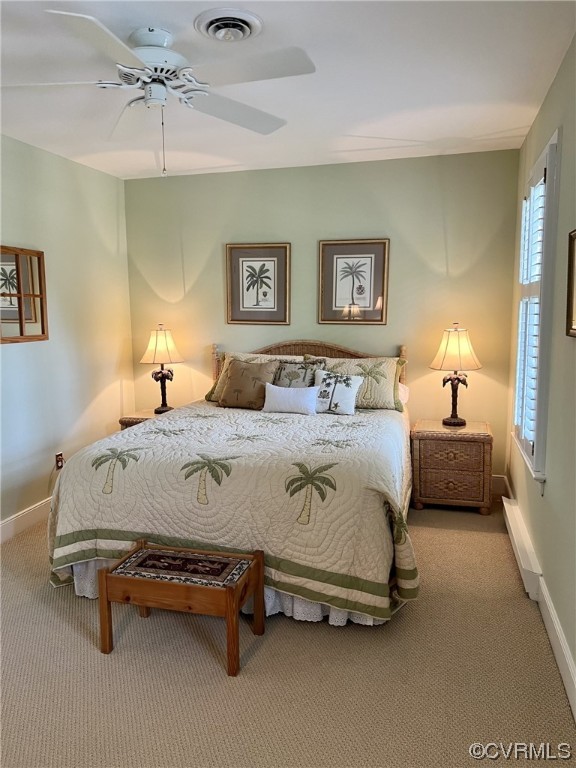 9408 Midvale Road Richmond, VA 23229 - Photo 19 of 24 a spacious bedroom with a bed and a chandelier