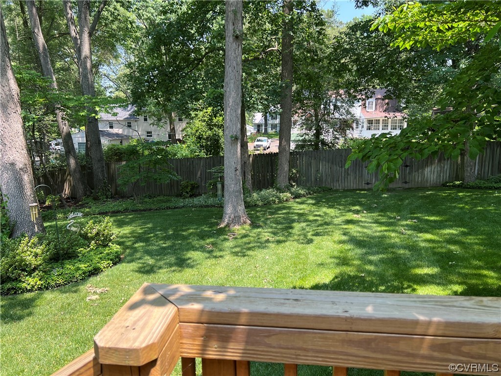 9408 Midvale Road Richmond, VA 23229 - Photo 23 of 24 a backyard of a house with lots of green space and fountain