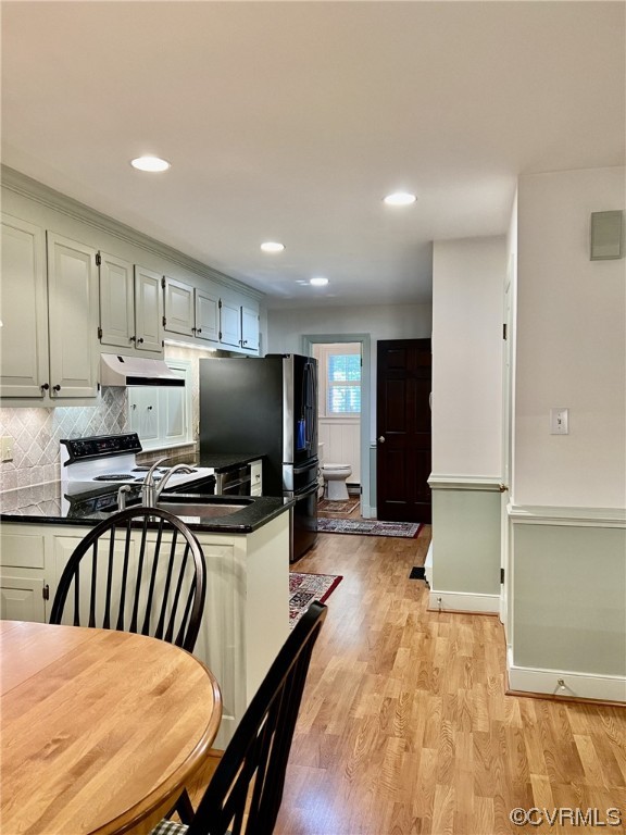 9408 Midvale Road Richmond, VA 23229 - Photo 6 of 24 a kitchen with a stove a refrigerator and a sink