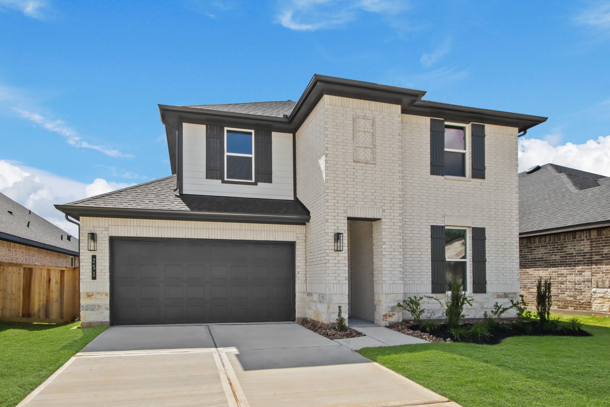 251 Springfield Terrace Drive Conroe, TX 77304 - Photo 1 of 23 a front view of a house with garden