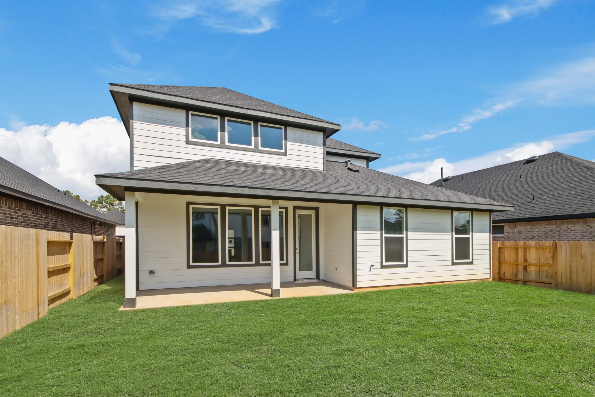 251 Springfield Terrace Drive Conroe, TX 77304 - Photo 13 of 23 a house that has a big yard large trees with wooden fence