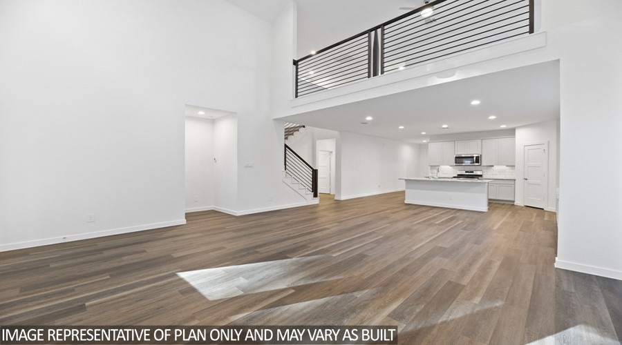 251 Springfield Terrace Drive Conroe, TX 77304 - Photo 8 of 23 a view of kitchen with kitchen island a sink wooden floor and a living room view