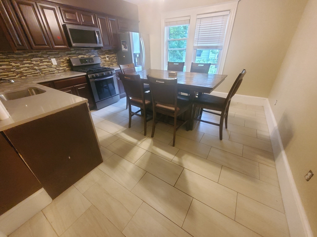 45 Intervale Street, Unit 2 Boston, MA 02121 - Photo 5 of 17 a view of a dining room with furniture