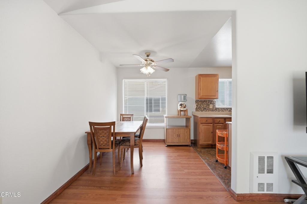 5154 Jefferson Square Oxnard, CA 93033 - Photo 8 of 23 a view of a dining room with furniture window and wooden floor