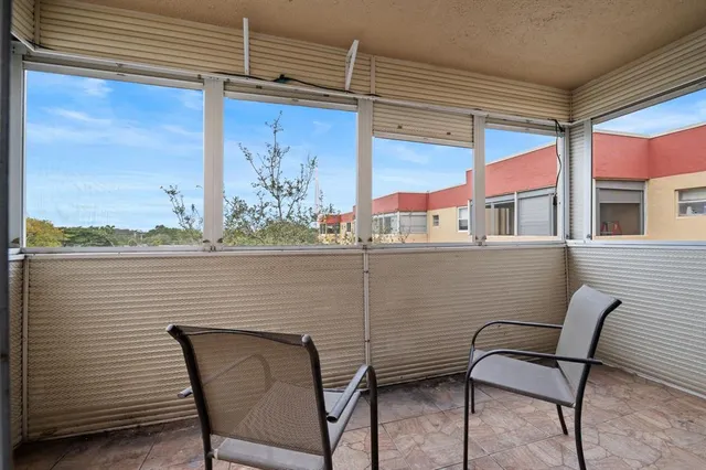 a view of chair and table in the balcony