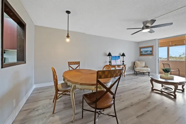 a dining room with furniture and window