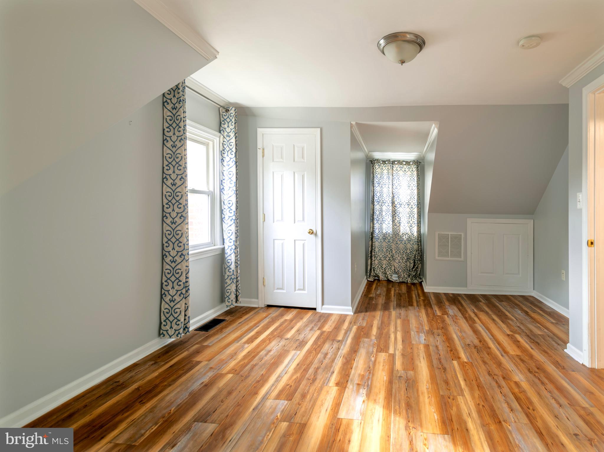 16 Norva Avenue Frederick, MD 21701 - Photo 11 of 15 a view of a room with wooden floor and bathroom