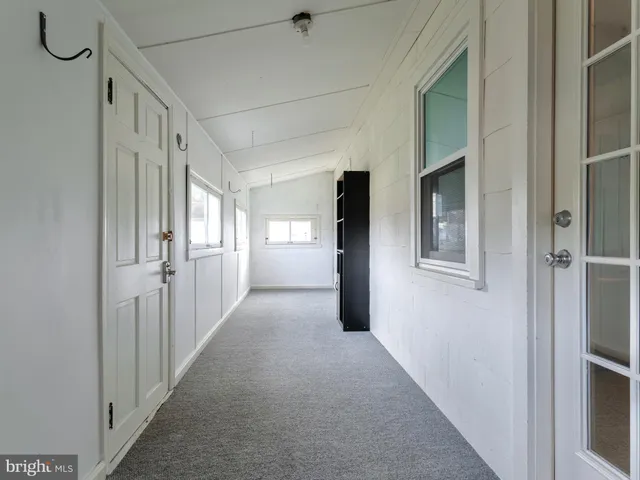 a view of a hallway with windows