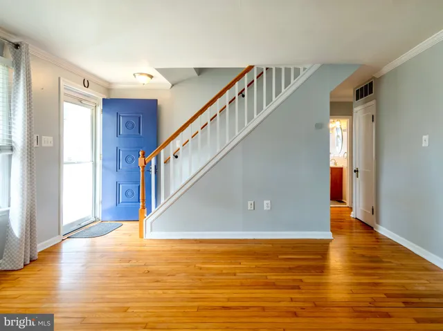 a view of an entryway with wooden floor