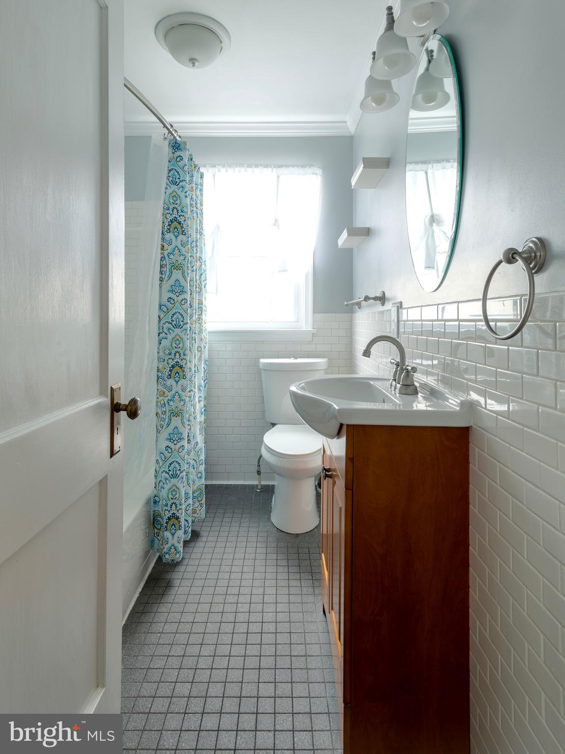 16 Norva Avenue Frederick, MD 21701 - Photo 8 of 15 a bathroom with a toilet a sink and a mirror