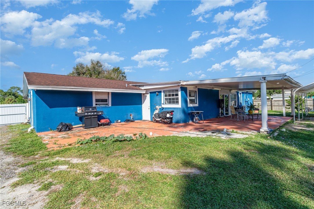 18 Illinois Road Lehigh Acres, FL 33936 - Photo 12 of 28 a view of house with outdoor space and patio