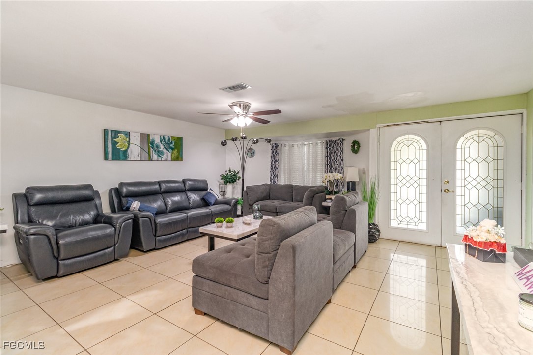 18 Illinois Road Lehigh Acres, FL 33936 - Photo 15 of 28 a living room with furniture and a large window