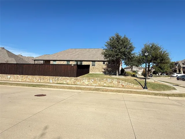 a view of swimming pool with a house in the background