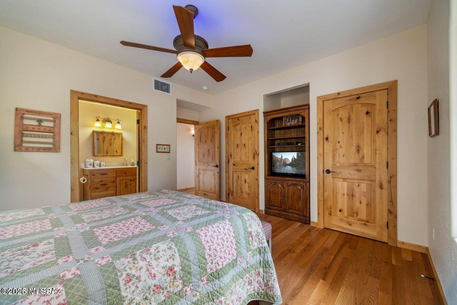 17 2195 Alpine, AZ 85920 - Photo 10 of 48 a bedroom with a bed and a chandelier