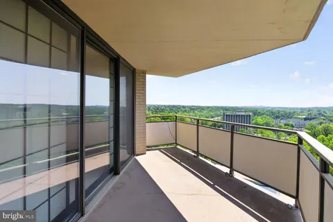 a view of balcony with furniture