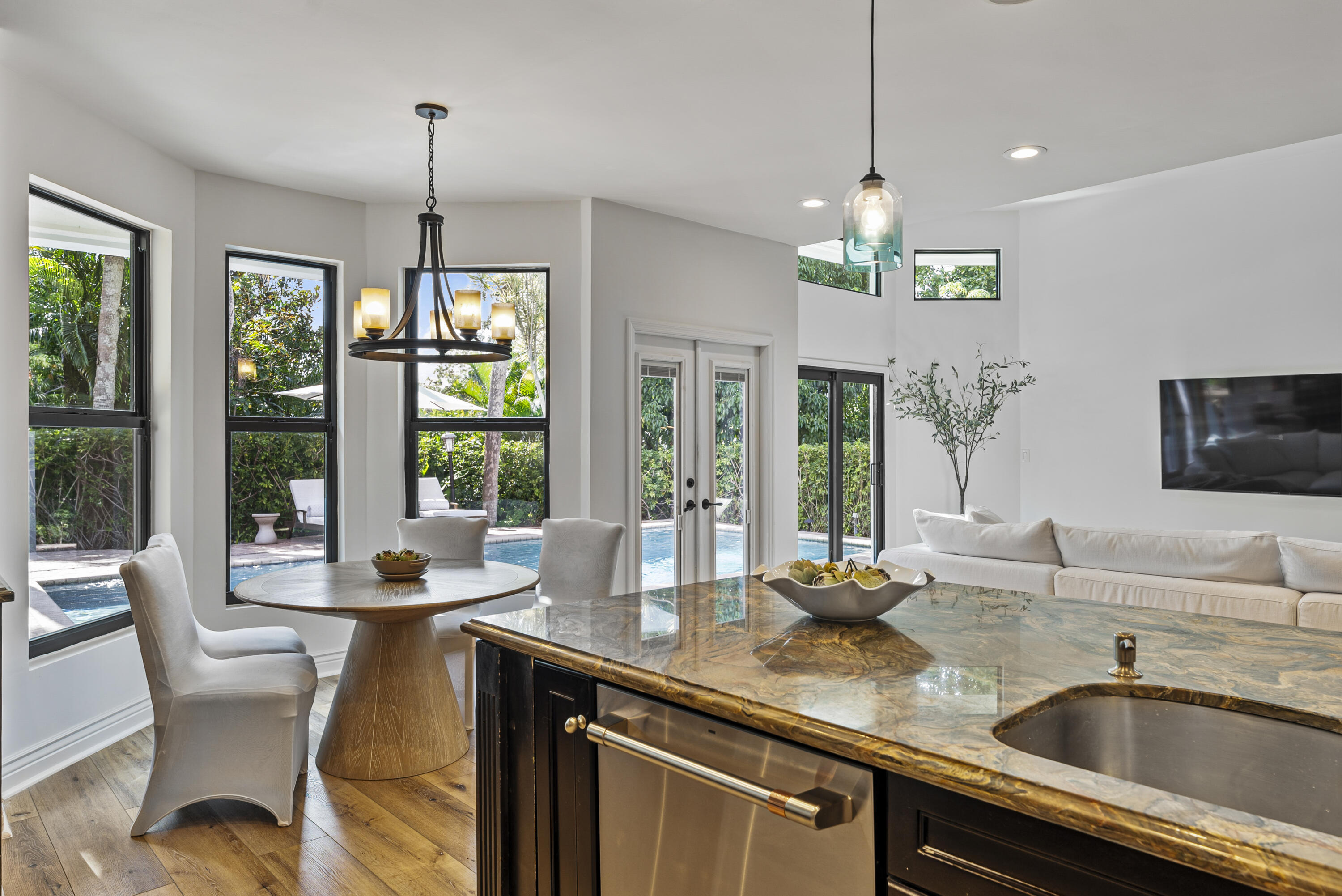 1925 Parkside Circle South Boca Raton, FL 33486 - Photo 23 of 61 a dining room with furniture a chandelier and window