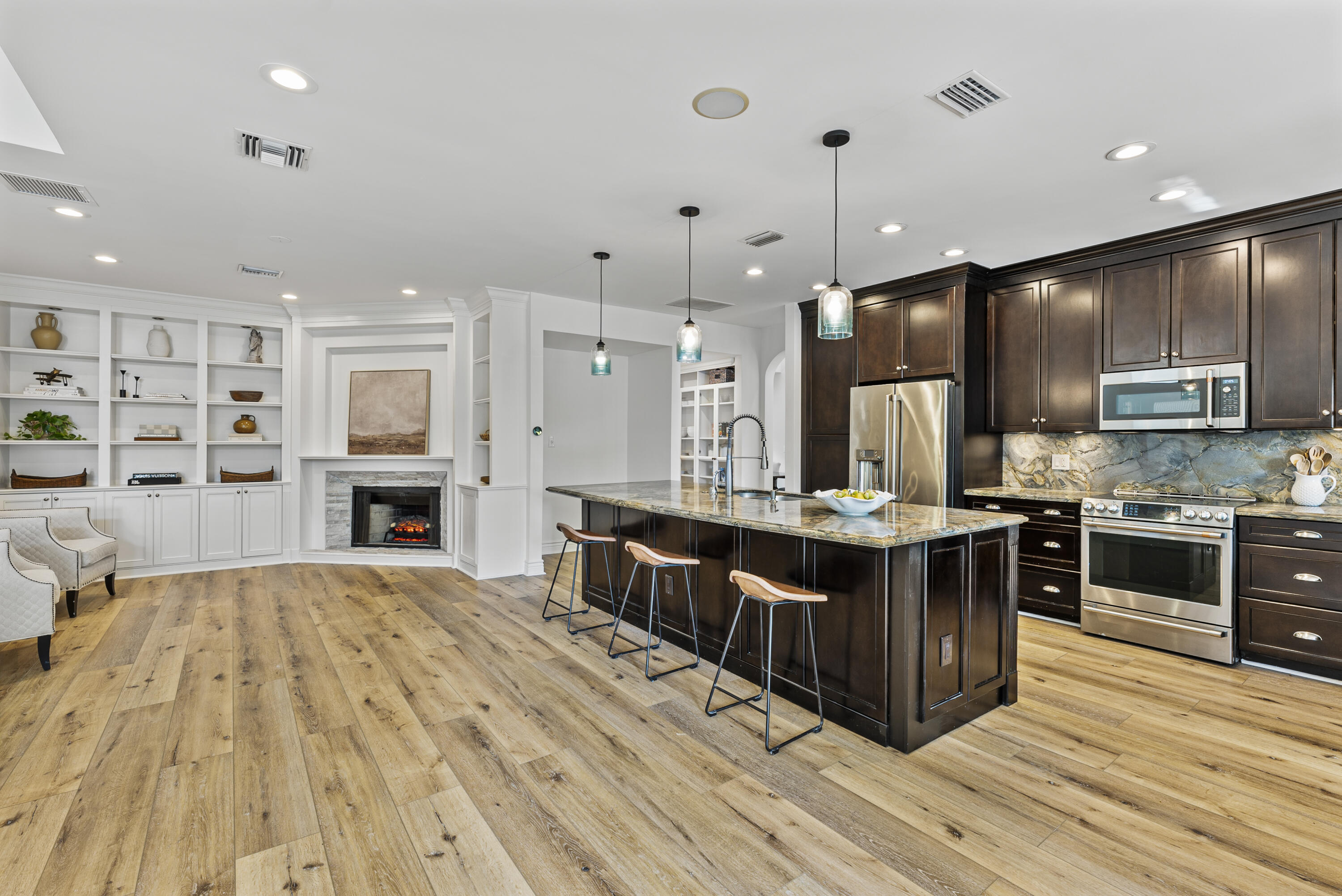 1925 Parkside Circle South Boca Raton, FL 33486 - Photo 27 of 61 a large kitchen with stainless steel appliances kitchen island granite countertop a large counter top and stove