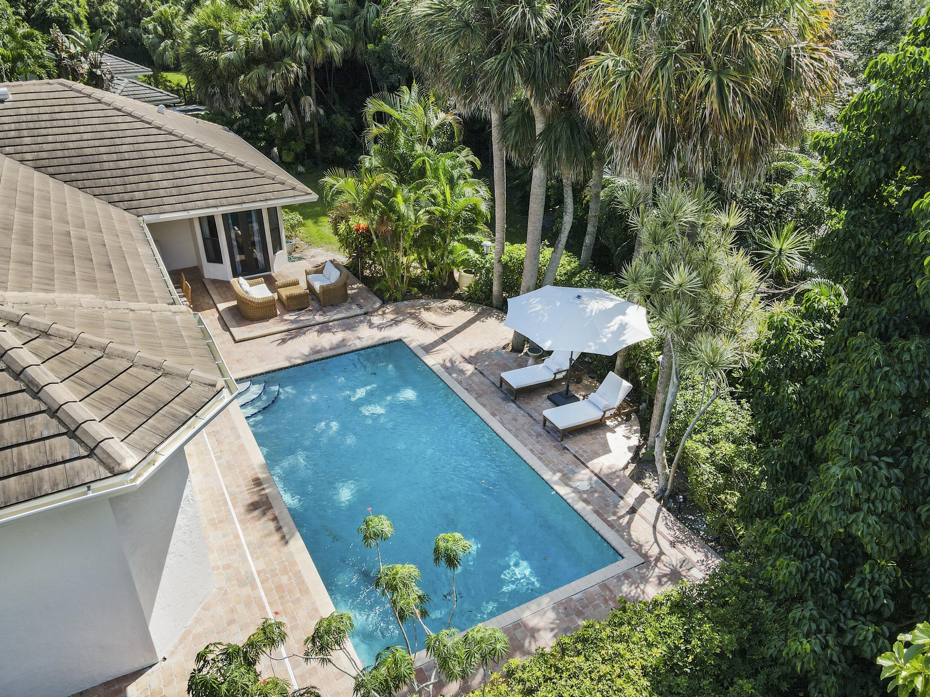 1925 Parkside Circle South Boca Raton, FL 33486 - Photo 3 of 61 a view of a backyard with plants and patio