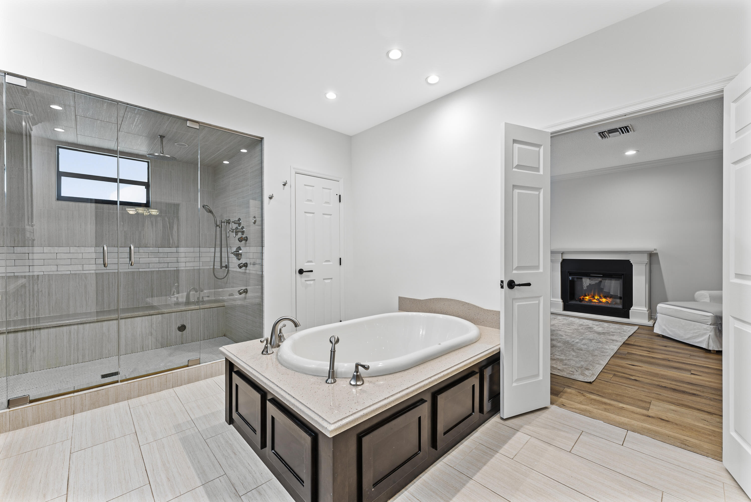 1925 Parkside Circle South Boca Raton, FL 33486 - Photo 38 of 61 a bathroom with a tub and a shower